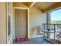 Inviting condo patio with seating and view, perfect for relaxing and enjoying the outdoors at 2203 Key West Ct # 432, Kissimmee, FL 34741