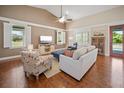 Cozy living room with comfortable seating, hardwood floors, and lots of natural light at 4561 Henry J Ave, St Cloud, FL 34772
