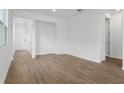 Bright living room with tile flooring and ample space for entertaining guests at 6385 Clover St, Lake Hamilton, FL 33851