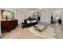 Elegant living room features neutral paint, tile flooring, and stylish furniture at 9509 Baycliff Ct, Orlando, FL 32836