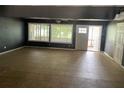 Spacious living room with large windows offering natural light and scenic views at 1512 Ison Ln, Ocoee, FL 34761