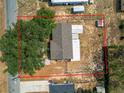 Aerial view of property showcasing the lot size, landscaping, and the home's roof at 629 N 7Th St, Lake Wales, FL 33853