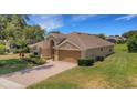 Inviting single-Gathering home boasting an attached two-car garage and a spacious driveway at 265 Del Sol Ave, Davenport, FL 33837