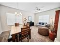 Inviting living room with plush seating, soft carpet, and abundant natural light through bright, sunny windows at 3633 Bristol Cove Ln, St Cloud, FL 34772