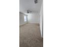 Bright bedroom featuring neutral carpet and a ceiling fan at 1723 Post Oak Dr, Davenport, FL 33837
