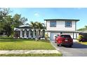Beautiful two-story home featuring a well-kept lawn and neat landscaping at 2227 Coventry Dr, Winter Park, FL 32792