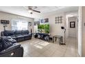 Cozy living room featuring tile floors, comfortable seating, and a bright, airy ambiance at 2535 Georgia Ave, Sanford, FL 32773