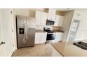 Well-equipped kitchen with stainless steel appliances and breakfast bar seating at 3041 Tobago Dr, Haines City, FL 33844