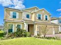 Inviting two-story home with manicured lawn and stone accents at 5019 Down Ct, St Cloud, FL 34772