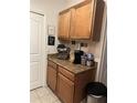 Coffee station featuring an espresso machine, standard coffee maker, and coffee decor at 6141 Metrowest Blvd # 303, Orlando, FL 32835
