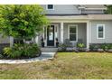 Inviting front porch with landscaping creates a warm welcome to this lovely home at 6200 Alligator Lake E Shr, St Cloud, FL 34771