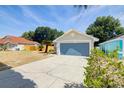 Inviting home with an attached garage and extended concrete driveway at 6593 Meritmoor Cir, Orlando, FL 32818