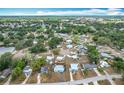 Expansive aerial view showcasing the neighborhood featuring mature trees and various home styles at 690 W Pearl St, Bartow, FL 33830