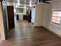 Bright open-concept living space features a spacious kitchen and hardwood floors at 6937 Gibraltar Rd, Orlando, FL 32822