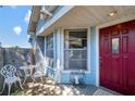 Cozy front porch with seating area, perfect for relaxing and enjoying the neighborhood views at 7218 Alston Ct, Orlando, FL 32835