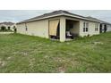 View of the backyard featuring a covered patio at 1104 Star Ruby Ln, Winter Haven, FL 33880