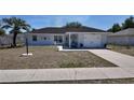 Charming single Gathering home featuring a one-car garage and well maintained lawn and landscaping at 15106 Sw 38Th Cir, Ocala, FL 34473
