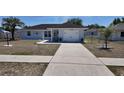 Charming single Gathering home featuring a one-car garage and well maintained lawn and landscaping at 15106 Sw 38Th Cir, Ocala, FL 34473