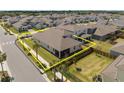 Aerial view highlighting property lines showing yard, screened in porch at 19283 Allium Pl, Orlando, FL 32827