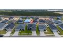 Aerial shot of a residential neighborhood showcasing well-maintained homes, green spaces, and a Gathering-friendly community layout at 2059 Dexter St, Haines City, FL 33844