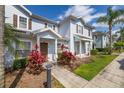 Beautiful townhouse with a landscaped front yard and covered entrance at 2903 Edenshire Way # 103, Kissimmee, FL 34746