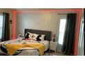 Themed bedroom with a Mickey Mouse motif and ambient lighting for a fun, modern feel at 334 Grosvenor Loop, Davenport, FL 33897