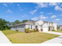 Charming single-Gathering home with well-manicured lawn and two-car garage at 348 Conway Ave, St Cloud, FL 34771