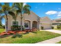 Inviting single-Gathering home with lush green lawn and lovely landscaping details at 3894 Wind Dancer Cir, St Cloud, FL 34772