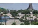 Scenic view of the community area with palm trees and lush greenery at 6165 Carrier Dr # 1603, Orlando, FL 32819