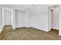 Bright living room featuring wood-look tile flooring and neutral paint at 804 Lake Dell Rd, Dundee, FL 33838
