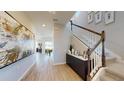 Bright foyer features modern decor, stairs, beautiful flooring and modern chandelier and natural light at 812 Lake Dell Rd, Dundee, FL 33838