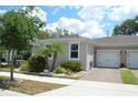 Inviting single story home showcasing a one-car garage and attractive landscaping at 1859 Shumard Ave, St Cloud, FL 34771