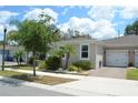 Charming single story home featuring a one-car garage and beautifully landscaped yard at 1859 Shumard Ave, St Cloud, FL 34771