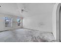 Bedroom with natural light from two windows and potential for customization at 207 Vervain Ave, Davenport, FL 33837