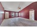 Bright and airy living room with tall ceilings, arched doorways, and large windows at 207 Vervain Ave, Davenport, FL 33837