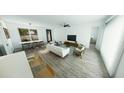 Bright, open-concept living room with modern furnishings and natural light at 2437 Sw 147Th Ln, Ocala, FL 34473