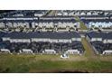 Aerial view showcasing the screened-in pools in this townhouse community at 2605 Reading Trl, Kissimmee, FL 34746