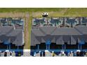 Aerial top-down view showcasing the roofs and parking areas of the townhouses at 2605 Reading Trl, Kissimmee, FL 34746