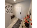 Charming entryway with modern decor, decorative mirror, and decorative flowers at 2883 Narcoossee Commons Way, St Cloud, FL 34771