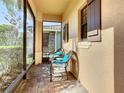 Relaxing screened-in porch with comfortable seating and views of the outdoors at 343 Scripps Ranch Rd, Poinciana, FL 34759