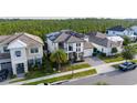 A picturesque overhead shot of a two-story house, enhanced with solar panels, set in a serene neighborhood at 6953 Broglie St, Orlando, FL 32827