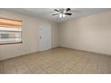Inviting living space featuring tiled floors, ample natural light, and a comfortable atmosphere at 704 Michigan Ct # 4, St Cloud, FL 34769