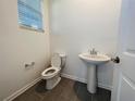 Powder room featuring a pedestal sink and modern fixtures for a sleek and functional design at 8023 Sayings Dr, Winter Garden, FL 34787