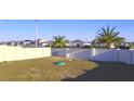 Spacious backyard enclosed by a white fence, offering privacy and room for outdoor activities at 804 Timberland Dr, Eagle Lake, FL 33839