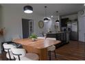 Well-lit dining area featuring modern furnishings and stylish pendant lighting at 9016 Pyrus St, Kissimmee, FL 34747