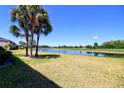 Picturesque backyard view with a serene pond and golf course, offering a tranquil and scenic outdoor space at 9435 Myrtle Creek Ln # 304, Orlando, FL 32832
