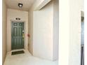 Welcoming entryway with a secure front door and neutral wall colors creating a clean, modern feel at 9435 Myrtle Creek Ln # 304, Orlando, FL 32832