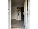 Home entryway with rug, painting and access to the rest of the home at 130 Avenue H Se, Winter Haven, FL 33880