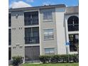 Three story condo building with screened in patios and handicap parking at 2130 Cascades Blvd # 108, Kissimmee, FL 34741