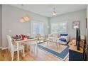 Open-concept living and dining area with stylish furnishings and natural light at 2611 Gala N Rd # 101, Kissimmee, FL 34746